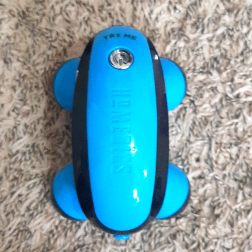 Hand held massager in blue